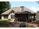 The backyard features a screened in porch and mature trees at 40 Templeton Ln, Villa Rica, GA 30180