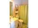 Neutral bathroom features a shower curtain and vanity with framed mirror at 40 Templeton Ln, Villa Rica, GA 30180