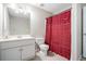 Bathroom featuring a single sink vanity and a toilet with red shower curtain at 40 Templeton Ln, Villa Rica, GA 30180