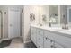 Bright bathroom with double vanity, white cabinets, and tile flooring at 40 Templeton Ln, Villa Rica, GA 30180