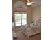 Bedroom featuring vaulted ceiling, large window, neutral colors, and decorative bed, creating a calming and inviting atmosphere at 40 Templeton Ln, Villa Rica, GA 30180