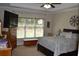 Spacious bedroom with a large window, ceiling fan, and comfortable bed at 40 Templeton Ln, Villa Rica, GA 30180