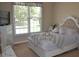 Bright bedroom with large window, neutral colors, and decorative bed, creating a calming and inviting atmosphere at 40 Templeton Ln, Villa Rica, GA 30180