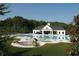 Community pool with a spacious pool house, tanning deck, and surrounding greenery at 40 Templeton Ln, Villa Rica, GA 30180