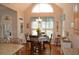 Bright and airy dining area with vaulted ceilings and hardwood floors adjacent to the kitchen at 40 Templeton Ln, Villa Rica, GA 30180