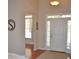 Bright entryway with wood floors, transom windows, and views into other rooms at 40 Templeton Ln, Villa Rica, GA 30180