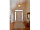 Bright entryway with wood floors, transom windows, and paneled front door with sidelights at 40 Templeton Ln, Villa Rica, GA 30180