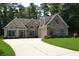 Beautiful home with stone and siding, dormer windows above the garage and a well-manicured lawn at 40 Templeton Ln, Villa Rica, GA 30180