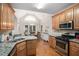 A beautifully appointed kitchen with stainless steel appliances and a view into the breakfast nook at 40 Templeton Ln, Villa Rica, GA 30180