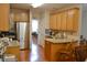 A cozy kitchen with stainless steel appliances, granite counters, and hardwood floors create a warm and inviting space at 40 Templeton Ln, Villa Rica, GA 30180