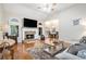 Cozy living room with hardwood floors, fireplace, and large windows at 40 Templeton Ln, Villa Rica, GA 30180