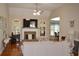Warm living room featuring a stone fireplace, vaulted ceilings, and lots of natural light at 40 Templeton Ln, Villa Rica, GA 30180