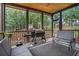 Relaxing screened porch with a grill, seating, and a wood ceiling, perfect for outdoor entertaining at 40 Templeton Ln, Villa Rica, GA 30180