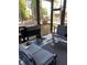 Relaxing screened porch with lounge chairs and a grill, designed for outdoor living and entertaining at 40 Templeton Ln, Villa Rica, GA 30180