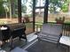 Inviting screened porch featuring comfortable seating and a grill, ideal for outdoor dining and relaxation at 40 Templeton Ln, Villa Rica, GA 30180
