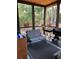 Cozy screened porch equipped with seating and a grill, perfect for enjoying the outdoors in comfort and style at 40 Templeton Ln, Villa Rica, GA 30180