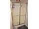 Bathroom featuring a glass-enclosed shower with silver trim, showcasing the shower fixtures and tile surround at 40 Templeton Ln, Villa Rica, GA 30180