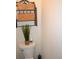 Bathroom featuring a standard toilet with decorative elements such as a shelf with baskets and plants at 40 Templeton Ln, Villa Rica, GA 30180