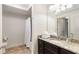 Bathroom showcasing a granite vanity top, a large mirror, and a shower with a curtain at 200 River Vista Dr # 401, Atlanta, GA 30339
