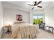 Sunlit bedroom features a cozy window seat, ceiling fan, and scenic outdoor views at 200 River Vista Dr # 401, Atlanta, GA 30339