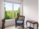 Bright bedroom area with a view of the surrounding landscape and window seat at 200 River Vista Dr # 401, Atlanta, GA 30339