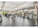 Bright and spacious gym equipped with modern exercise machines, large windows, and ceiling fans at 200 River Vista Dr # 401, Atlanta, GA 30339