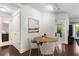 Bright living room showcasing hardwood floors and a dining table with seating for four at 200 River Vista Dr # 401, Atlanta, GA 30339