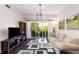 Bright living room with balcony access and modern lighting at 200 River Vista Dr # 401, Atlanta, GA 30339