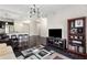 Open-concept living area featuring modern furnishings, hardwood floors, and access to kitchen and balcony at 200 River Vista Dr # 401, Atlanta, GA 30339