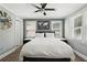 Bright bedroom features a neutral color scheme, large windows, and hardwood floors, offering a peaceful retreat at 2015 Cascade Sw Rd, Atlanta, GA 30311