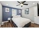 Cozy bedroom featuring hardwood floors, a ceiling fan, and stylish decor at 2015 Cascade Sw Rd, Atlanta, GA 30311