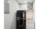 Compact kitchen features a retro-style refrigerator and a classic white stove, blending vintage charm with modern functionality at 2015 Cascade Sw Rd, Atlanta, GA 30311