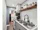 Clean and functional kitchen area with stainless steel sink, subway tile backsplash, and modern fixtures at 2015 Cascade Sw Rd, Atlanta, GA 30311