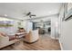 Open-concept living room with hardwood floors that flows into the kitchen and dining area, creating a bright and welcoming space at 2015 Cascade Sw Rd, Atlanta, GA 30311