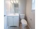 Bathroom featuring white fixtures, a vanity, and a toilet at 3777 Oakland Spring Ct, Snellville, GA 30039