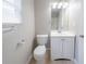 Clean bathroom with white vanity, toilet, and silver fixtures features neutral tones at 3777 Oakland Spring Ct, Snellville, GA 30039