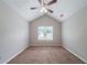 Bedroom with vaulted ceilings, neutral walls and carpet with a window for natural light at 3777 Oakland Spring Ct, Snellville, GA 30039