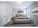This bedroom features a neutral palette, stylish decor, and a large window for ample natural light at 3777 Oakland Spring Ct, Snellville, GA 30039