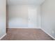 This vacant bedroom offers plush carpeting and neutral walls for a cozy and inviting space to unwind and relax at 3777 Oakland Spring Ct, Snellville, GA 30039