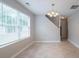 Bright dining room featuring large windows and a stylish chandelier at 3777 Oakland Spring Ct, Snellville, GA 30039