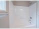 Clean white shower stall with built-in shelves and modern fixtures at 3777 Oakland Spring Ct, Snellville, GA 30039