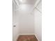 Carpeted walk-in closet with one wire shelf near the ceiling and a door at 3777 Oakland Spring Ct, Snellville, GA 30039