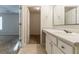 View of bathroom featuring a vanity with a mirror and a view towards the bedroom at 3856 Vine Stone Dr, Lithonia, GA 30038