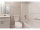 Bright bathroom featuring a single sink vanity and a shower-tub combination with white tile surround at 3856 Vine Stone Dr, Lithonia, GA 30038
