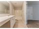 Well-lit bathroom features a combined shower and tub, sleek vanity, and neutral tones at 3856 Vine Stone Dr, Lithonia, GA 30038