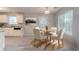 Dining area next to the kitchen with table, chairs, and ample natural light at 3856 Vine Stone Dr, Lithonia, GA 30038