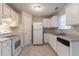 Well-maintained kitchen with essential appliances and ample counter space at 3856 Vine Stone Dr, Lithonia, GA 30038