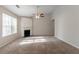 Spacious living room featuring a fireplace, neutral paint, and plush carpeting at 3856 Vine Stone Dr, Lithonia, GA 30038