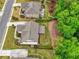 Beautiful aerial view of landscaped backyard with patio and outdoor fireplace of home in lush green neighborhood at 5250 Briarstone Ridge Way, Alpharetta, GA 30022