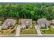 Aerial view of three luxury homes surrounded by mature trees, showcasing expansive lots and landscaping at 5250 Briarstone Ridge Way, Alpharetta, GA 30022